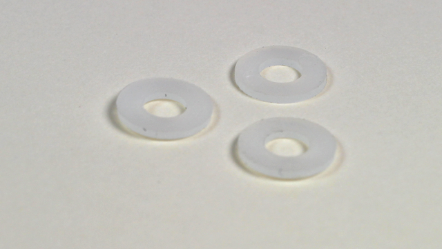 Underlagsskive til glaslåge Ø9x0,8 mm, transparent plastik (10 stk)